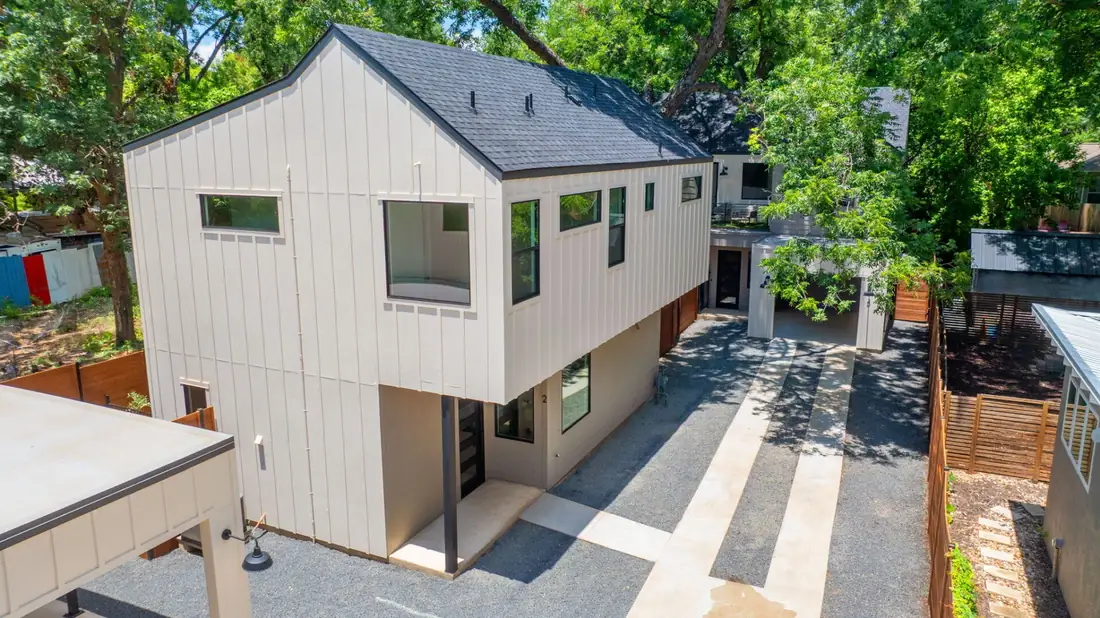 Aerial view of a modern Precise home with a roof terrace on Holly St