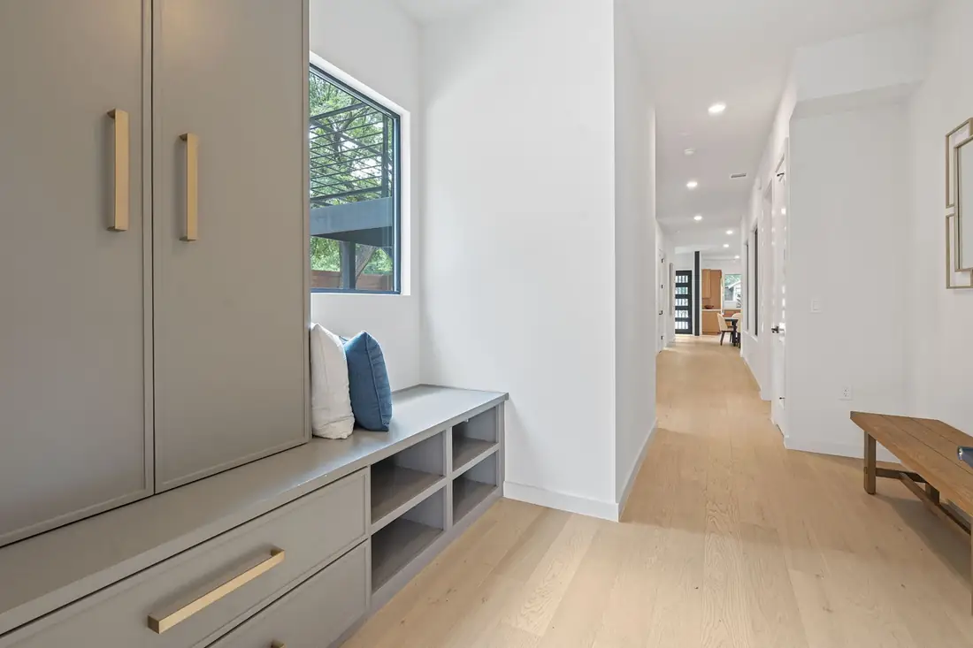 Built-in hall bench and storage in a Precise home
