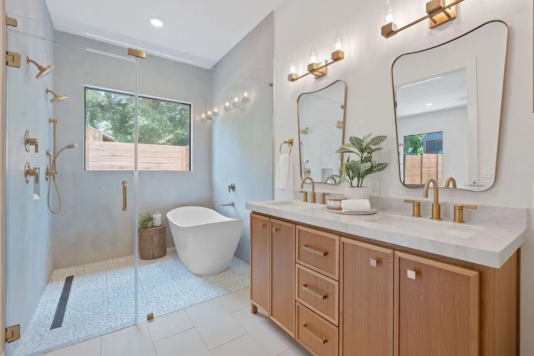 Primary bath with a freestanding tub and oak vanity designed in-house