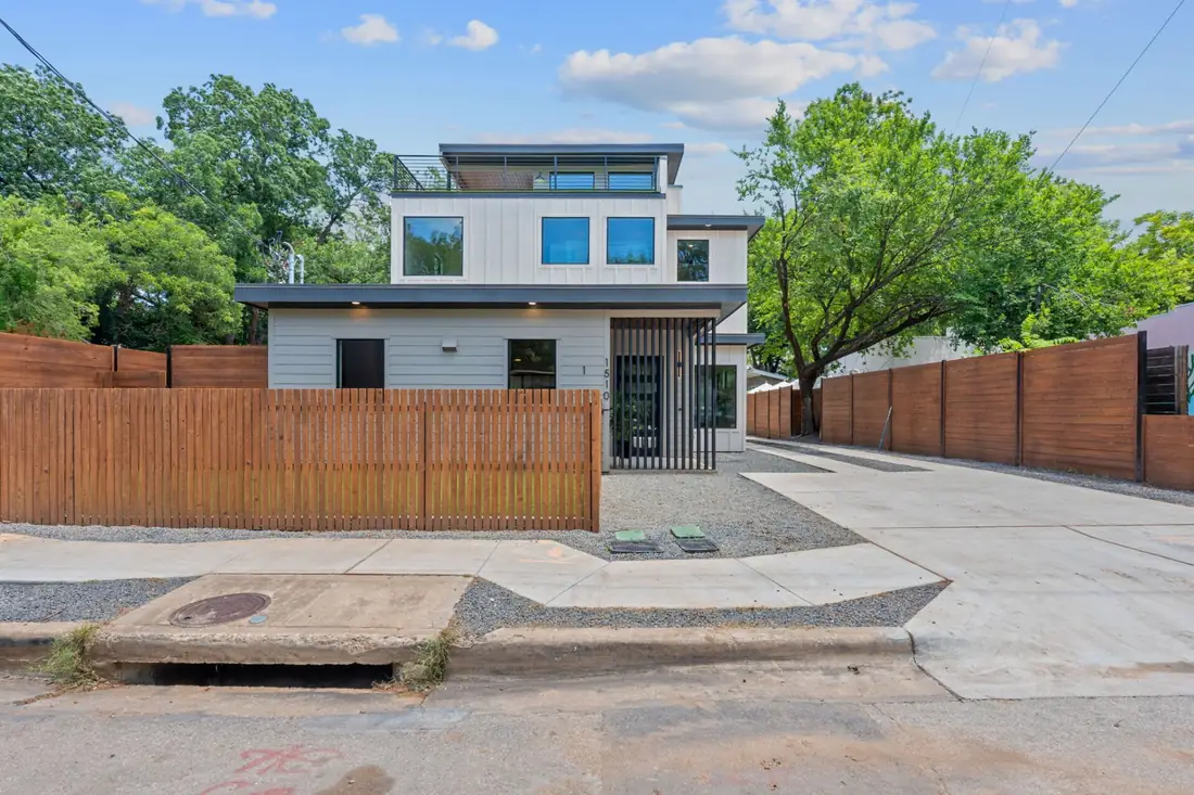 Precise homes on Holly St, East Austin, seen from the street