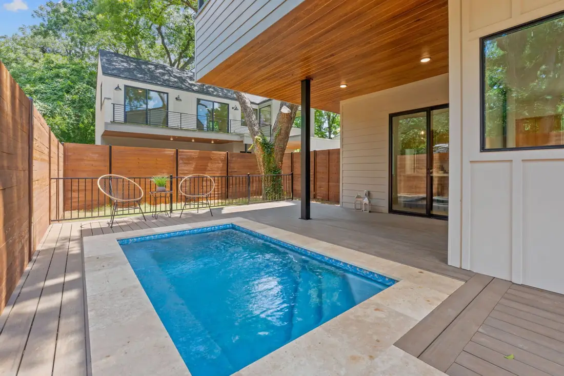 Plunge pool beside a modern Precise home on Holly St