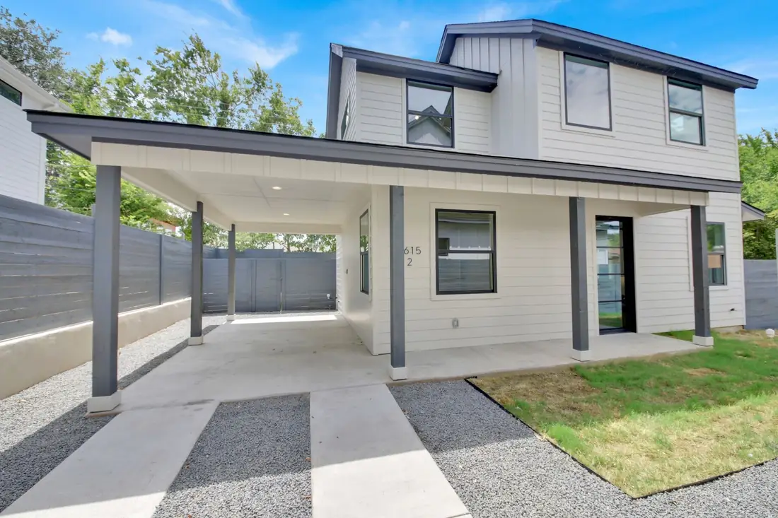 Second S 2nd St home with a covered carport and front lawn