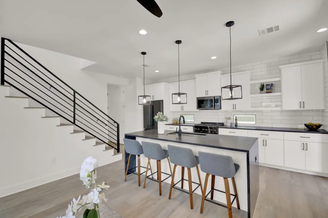 Kitchen with four bar stools at a quartz island